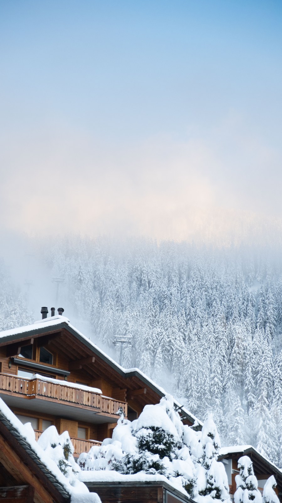 Snow-covered chalets and mountain landscape in Verbier