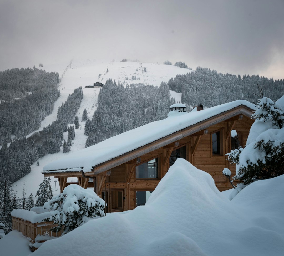 Alpine wooden chalet in a snowy mountain landscape