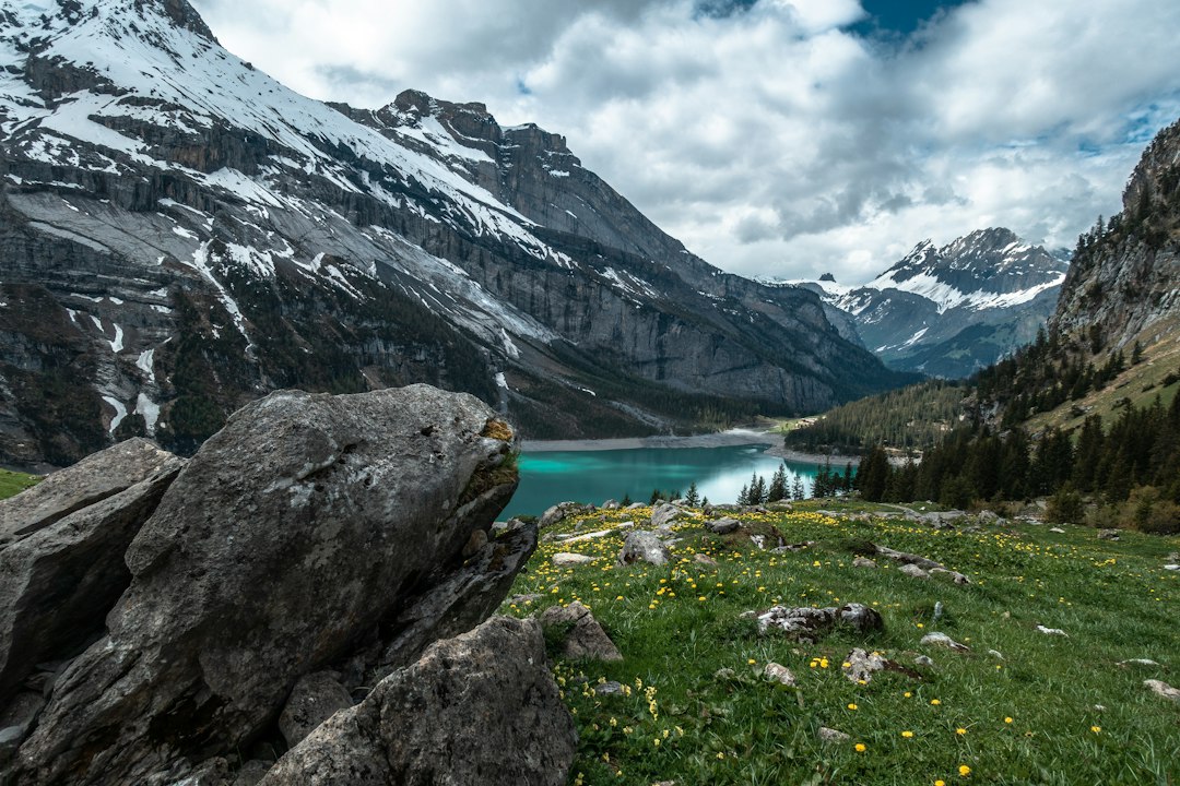 Lake Oeschinensee and snow-capped Swiss Alps, Switzerland